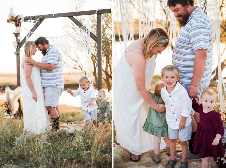 A family with three young children hug and laugh while the children play in a field at a family photo session in Tuttle, Oklahoma