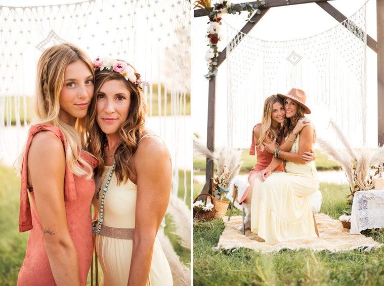 A mom and teen daughter dressed in boho style pose in front of boho decorations and a field and pond in the country in Oklahoma