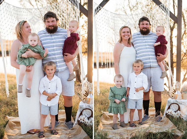 A family with three young children hug and laugh at a family photo session in a field in Tuttle, Oklahoma