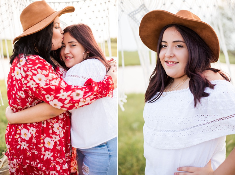 A mom and teen daughter dressed in boho style pose in front of boho decorations and a field and pond in the country in Oklahoma