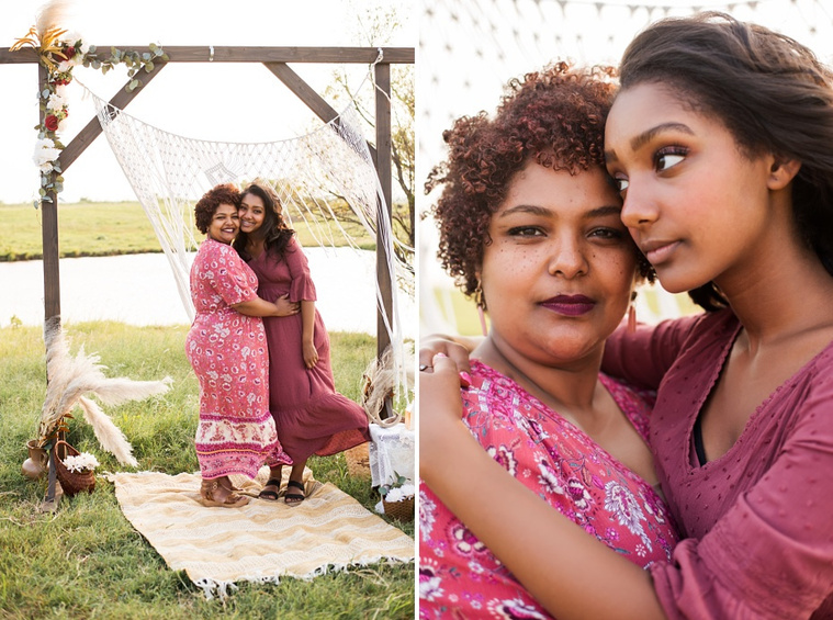 A mom and teen daughter dressed in boho style pose in front of boho decorations and a field and pond in the country in Oklahoma