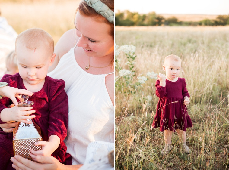 A mom smiles down at her toddler daughter in her lap; The daughter stands alone in a field at a family photo session in Tuttle, Oklahoma
