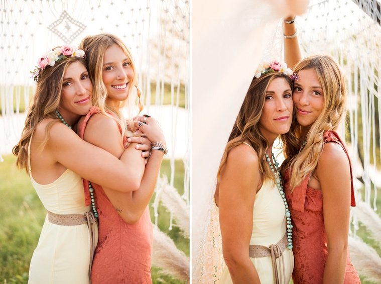 A mom and teen daughter dressed in boho style pose in front of boho decorations and a field and pond in the country in Oklahoma