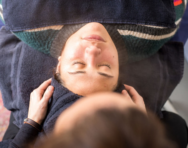 overhead branding shot of an aesthetician prepping her client for a facial at Shear Frost Salon in Moore Oklahoma