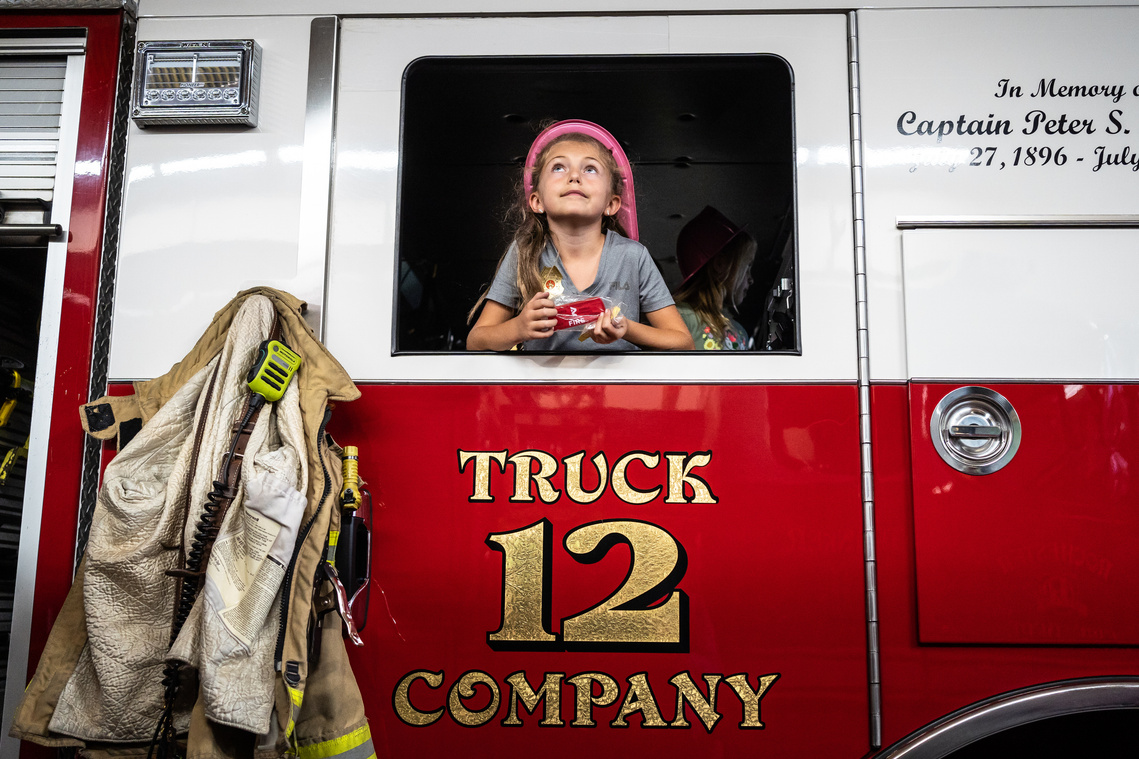 Emma Kastner, 8, of Rochester, checks out the view from inside Engine 12 during an open house on Tuesday, Oct. 5, 2021, during fire prevention week at Fire Station 1 in Rochester, Minnesota. 