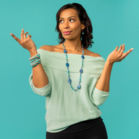 Image shows Isabel De Montiel with hands on aqua blue background. Isabel De Montiel is Atlas Studios preferred image stylist and consultant. 