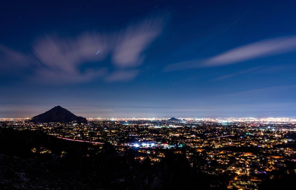 Long exposure night time view of Phoenix, Arizona looking towards Camelback Mountain.