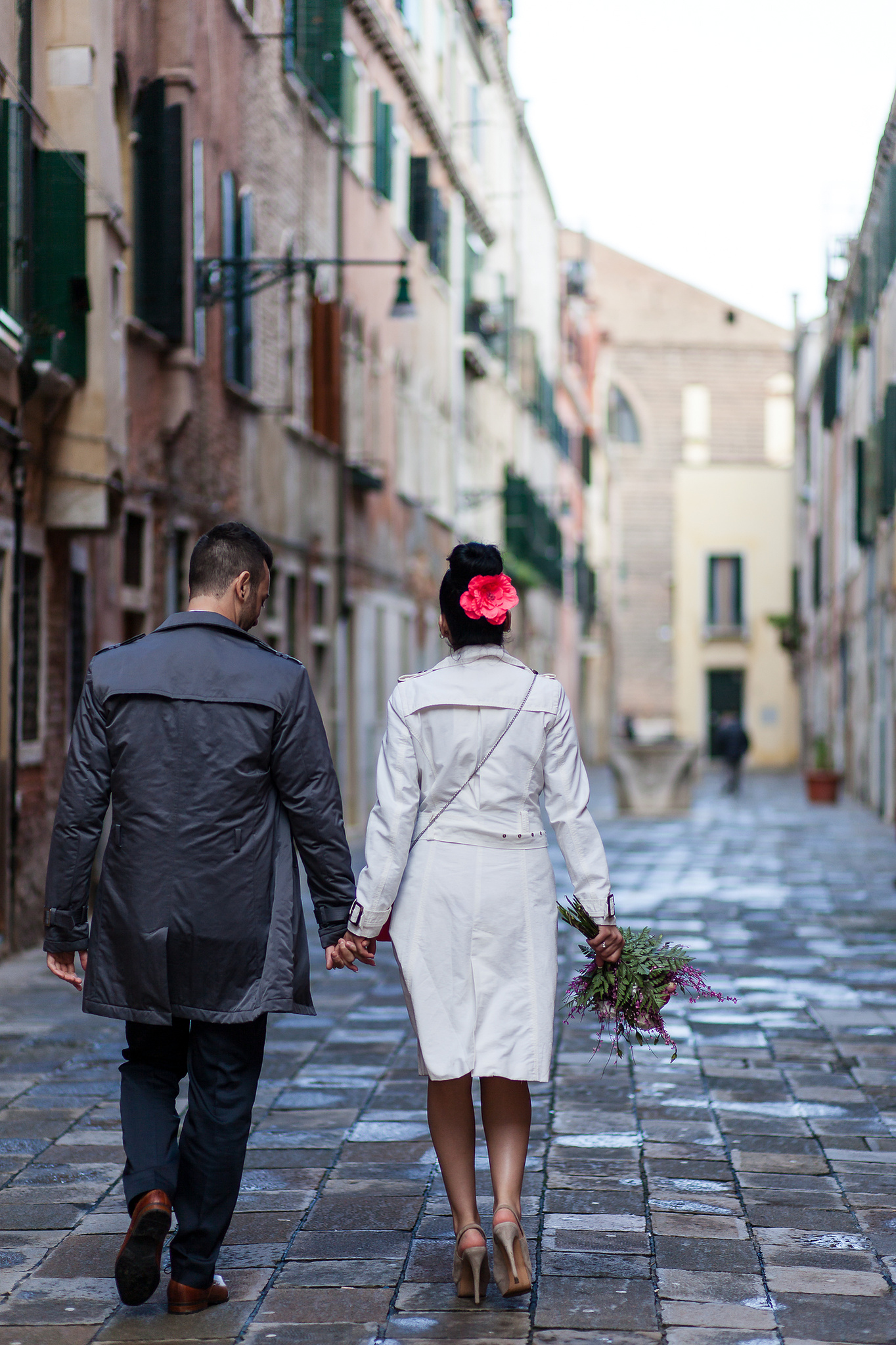bride and groom walking to their future together after a wedding in venice
