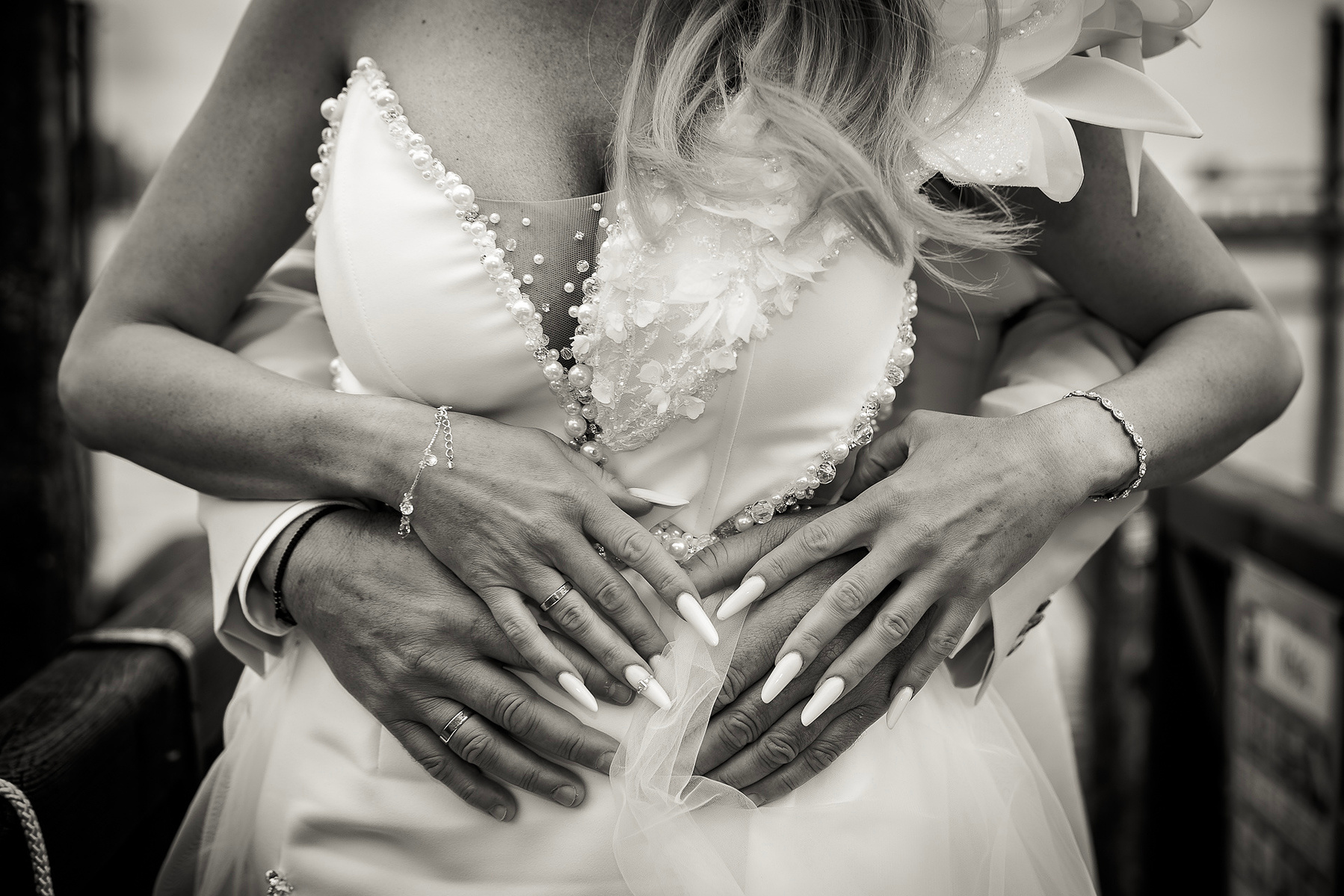 details of bridal dress and wedding rings