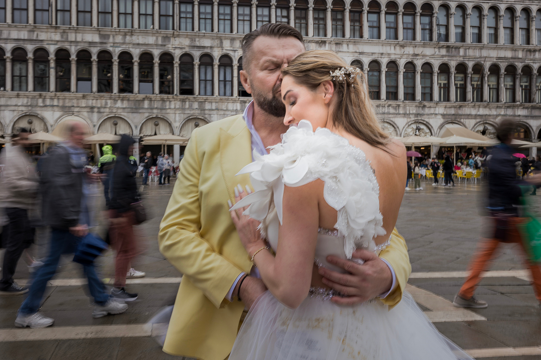 bride and groom in st. Marks square