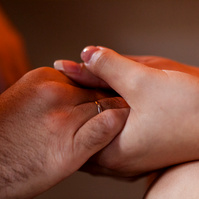 bride and groom holding hands at the wedding