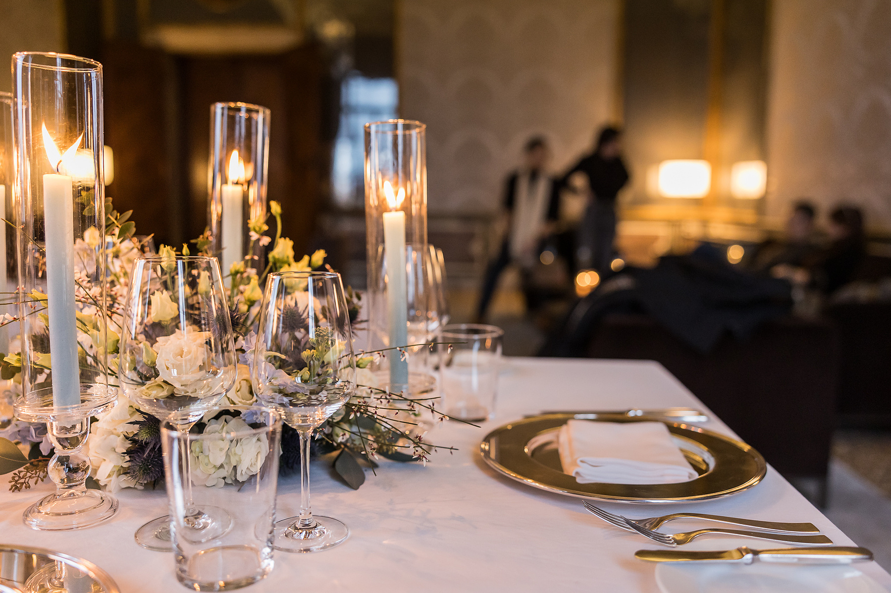 Detail of the table arrangement and the party in the background