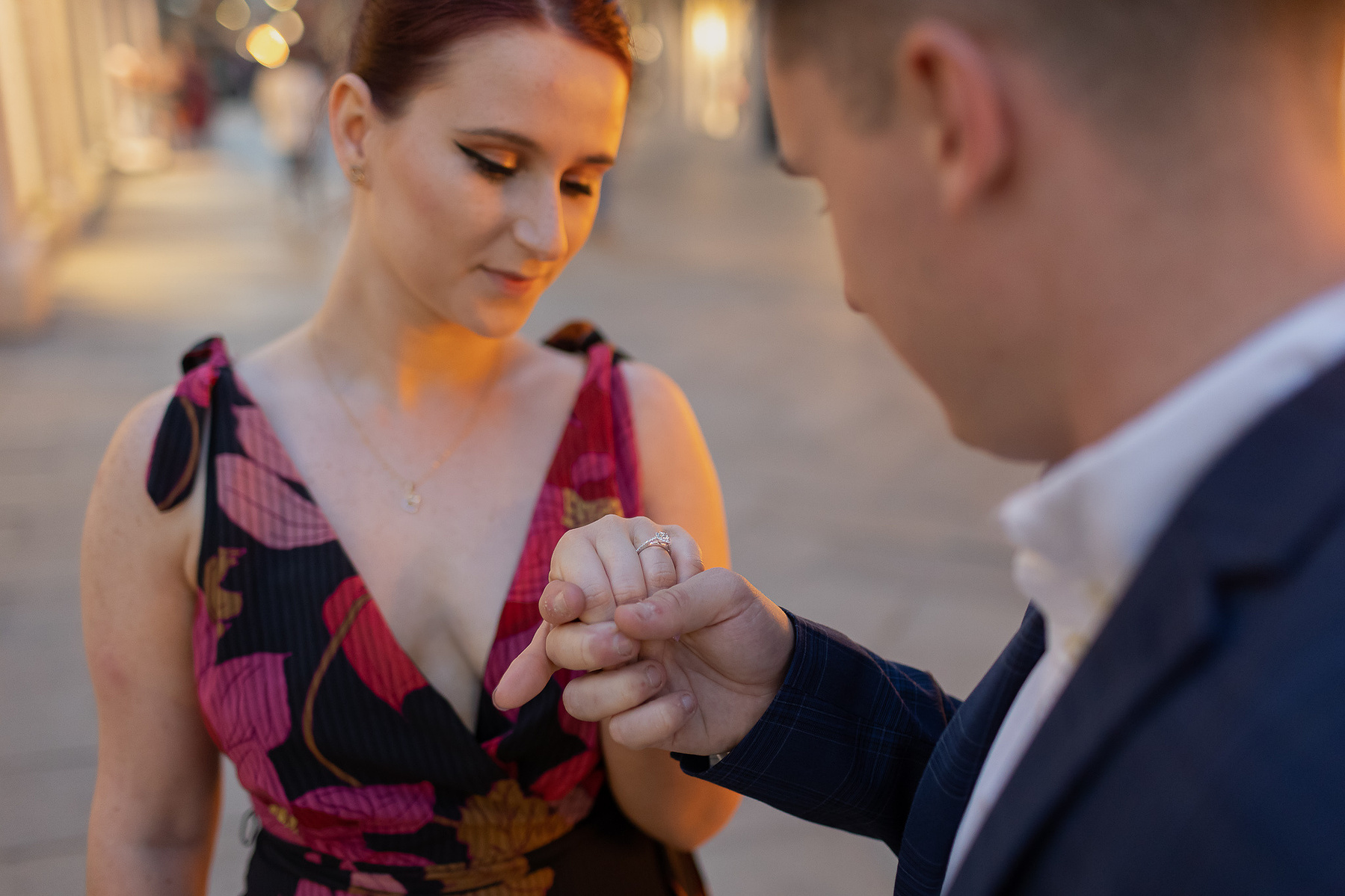 Just engaged couple looking at the ring