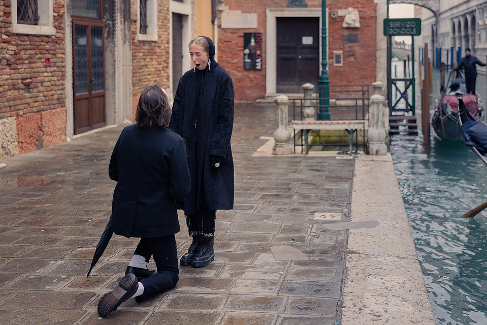 Moment of a candid surprise proposal in Venice