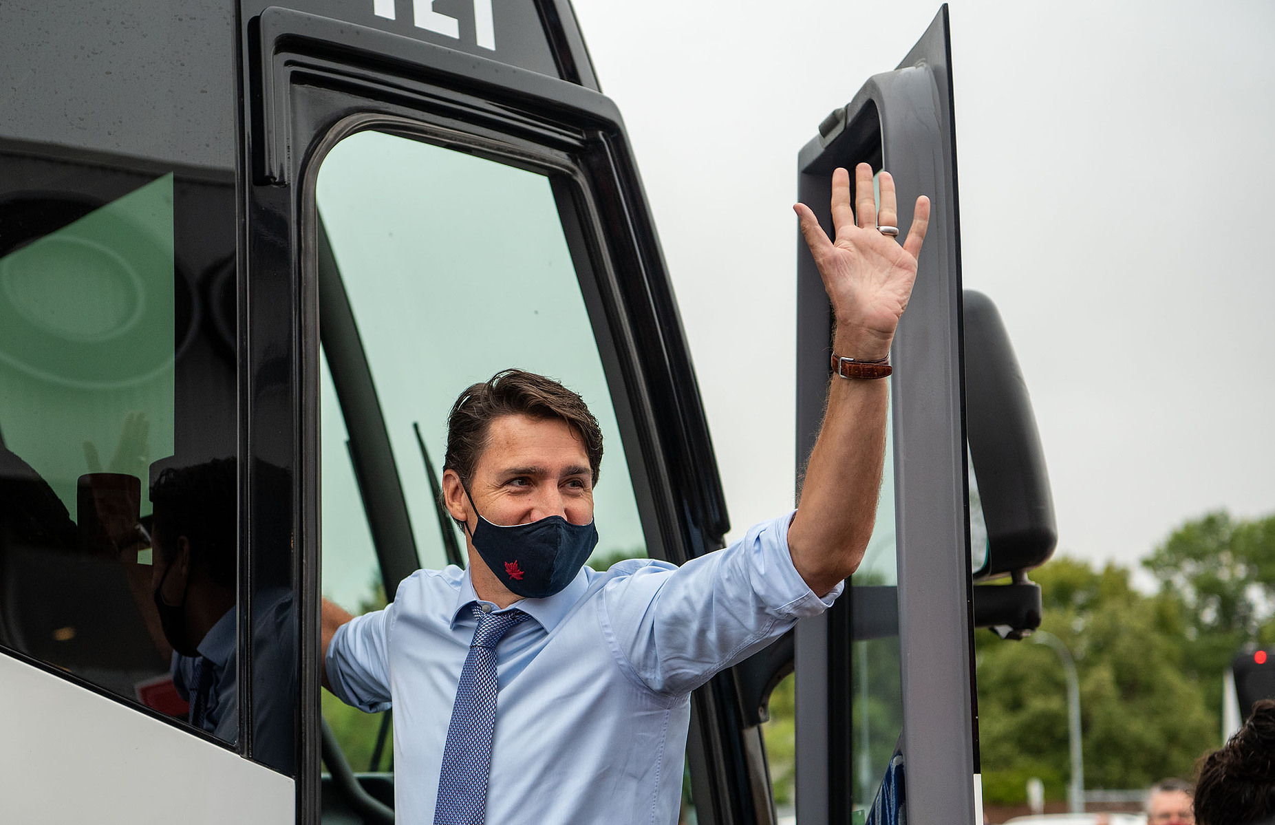 Liberal Leader Justin Trudeau waves at  supporters gathered outside of the Cavalier Drive FoodFare location in Winnipeg on Aug. 20, 2021.