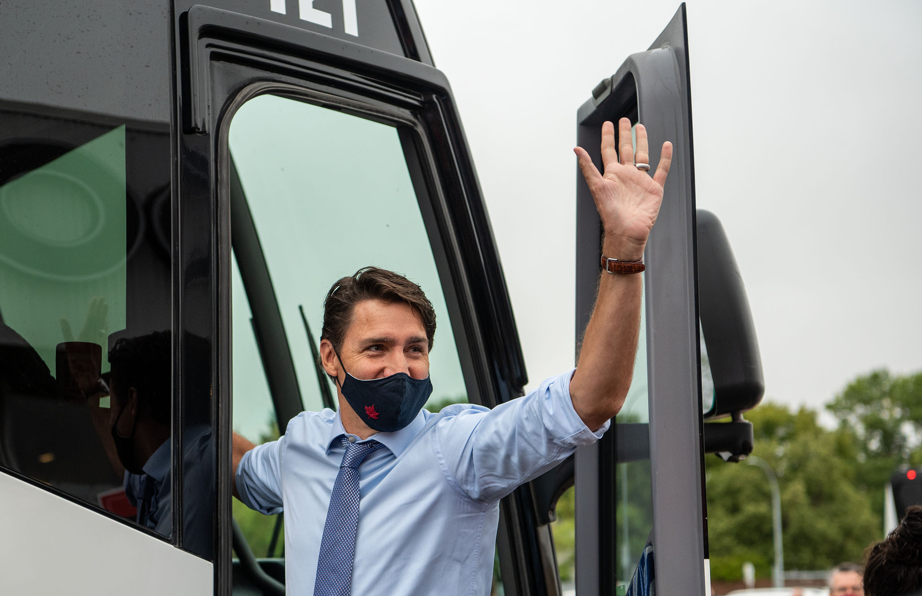 Liberal Leader Justin Trudeau waves at  supporters gathered outside of the Cavalier Drive FoodFare location in Winnipeg on Aug. 20, 2021.