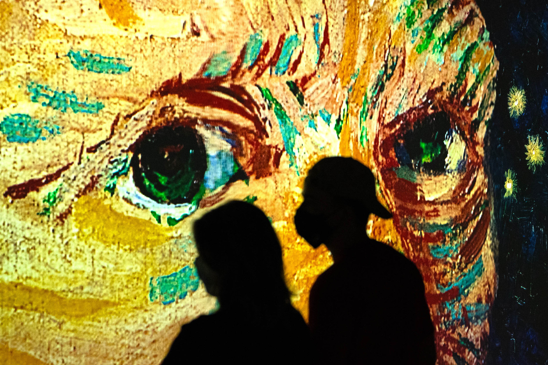 TORONTO, Ont. (11/09/21) - Visitors to Immersive Van Gogh--an audio-visual experience where artworks by Vincent Van Gogh are projected onto walls--are photographed in Toronto, Ont. on Sept. 11, 2021. Photo by Alex Lupul