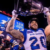 Winnipeg Blue Bombers running back Brady Oliveira hoists the Grey Cup following the team’s 33-25 victory over the Hamilton Tiger-Cats on Dec. 12 at Tim Hortons Field in Hamilton, Ont. This is the Blue Bombers’ second consecutive championship.