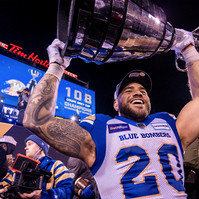 Winnipeg Blue Bombers running back Brady Oliveira hoists the Grey Cup following the team’s 33-25 victory over the Hamilton Tiger-Cats on Dec. 12 at Tim Hortons Field in Hamilton, Ont. This is the Blue Bombers’ second consecutive championship.