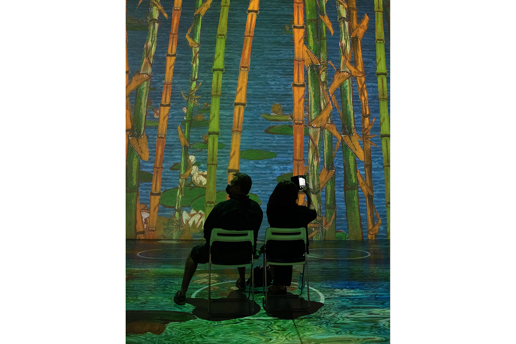 TORONTO, Ont. (11/09/21) - Visitors to Immersive Van Gogh--an audio-visual experience where artworks by Vincent Van Gogh are projected onto walls--are photographed in Toronto, Ont. on Sept. 11, 2021. Photo by Alex Lupul