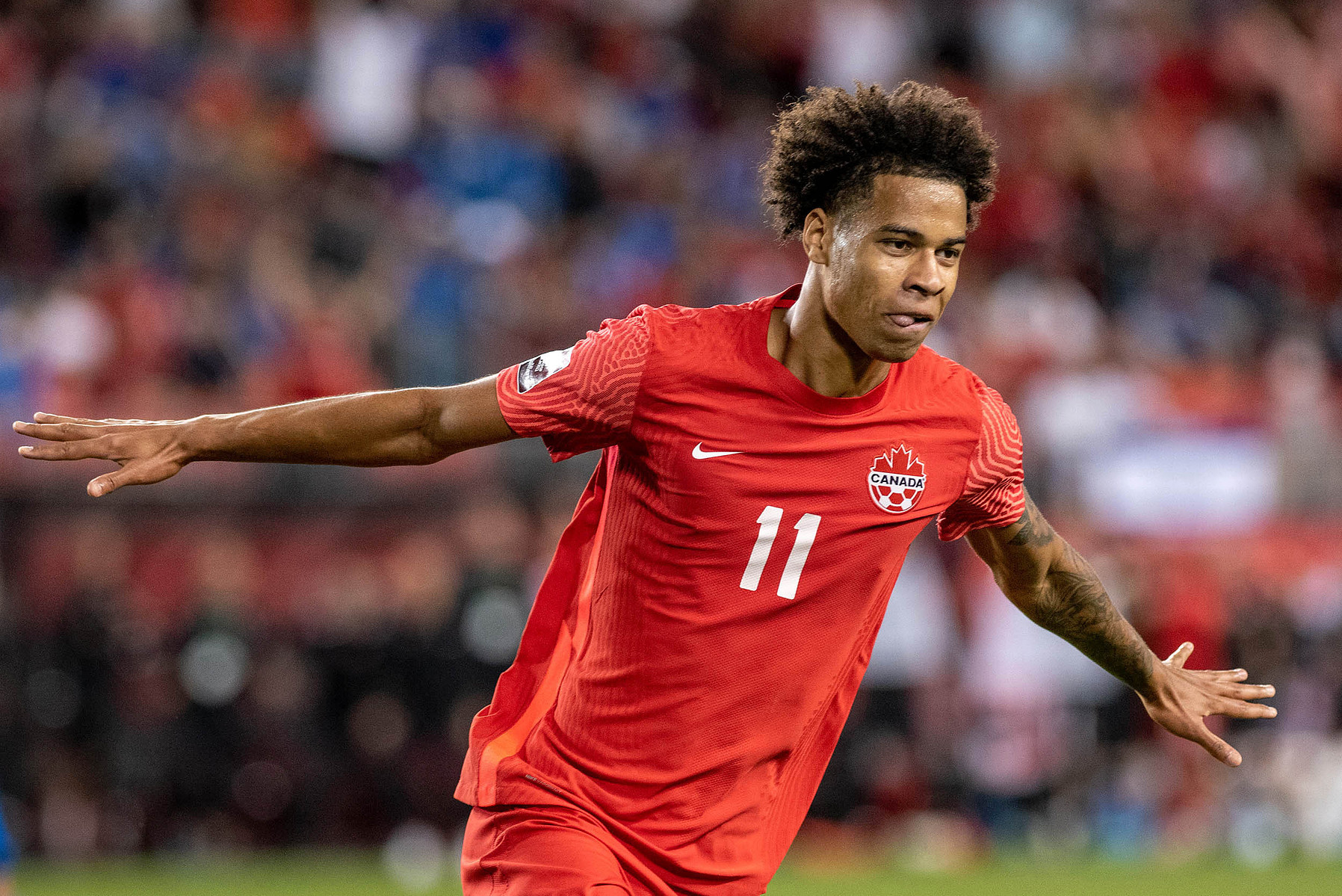 TORONTO, Ont. (08/09/21) - Canada's Tajon Buchanan celebrates after scoring a goal during a 3-0 victory against El Salvador at BMO Field in Toronto on Sept. 8, 2021. Photo by Alex Lupul
