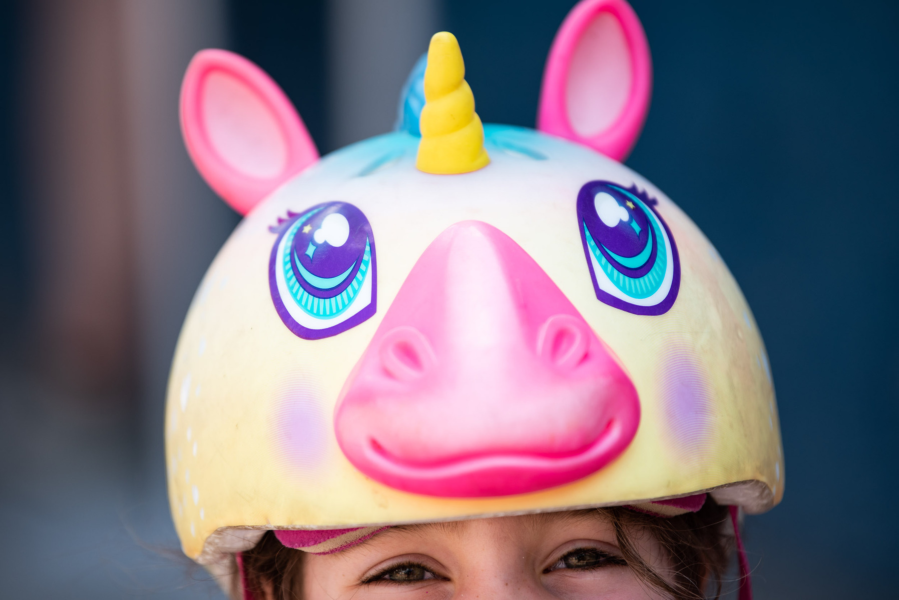 Sophie Campbell and her unicorn cycling helmet are photographed during the Tour de Glace, a 20-kilometre recreational event which makes stops at four local ice cream shops, outside of Dug & Betty's Ice Creamery in Winnipeg on July 24, 2021.
