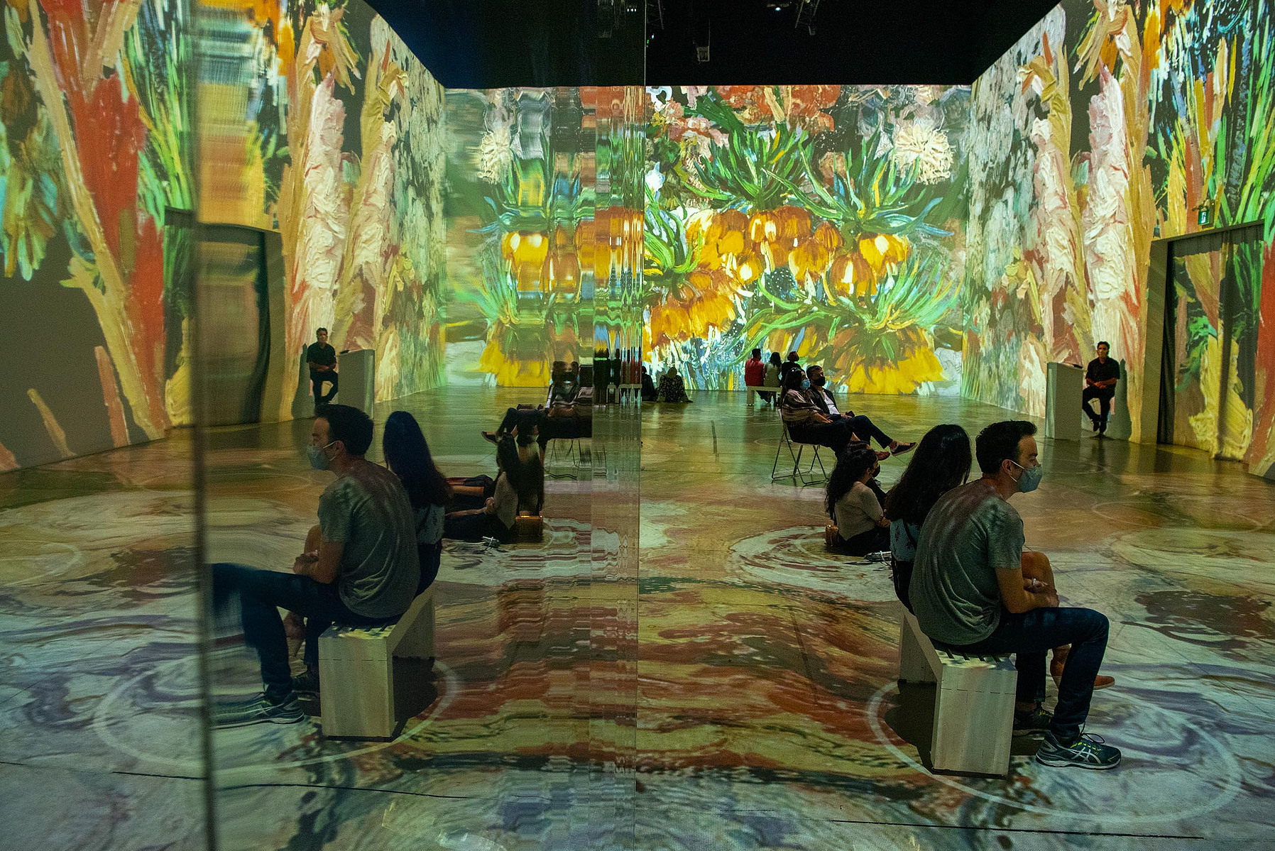 TORONTO, Ont. (11/09/21) - Visitors to Immersive Van Gogh--an audio-visual experience where artworks by Vincent Van Gogh are projected onto walls--are photographed in Toronto, Ont. on Sept. 11, 2021. Photo by Alex Lupul