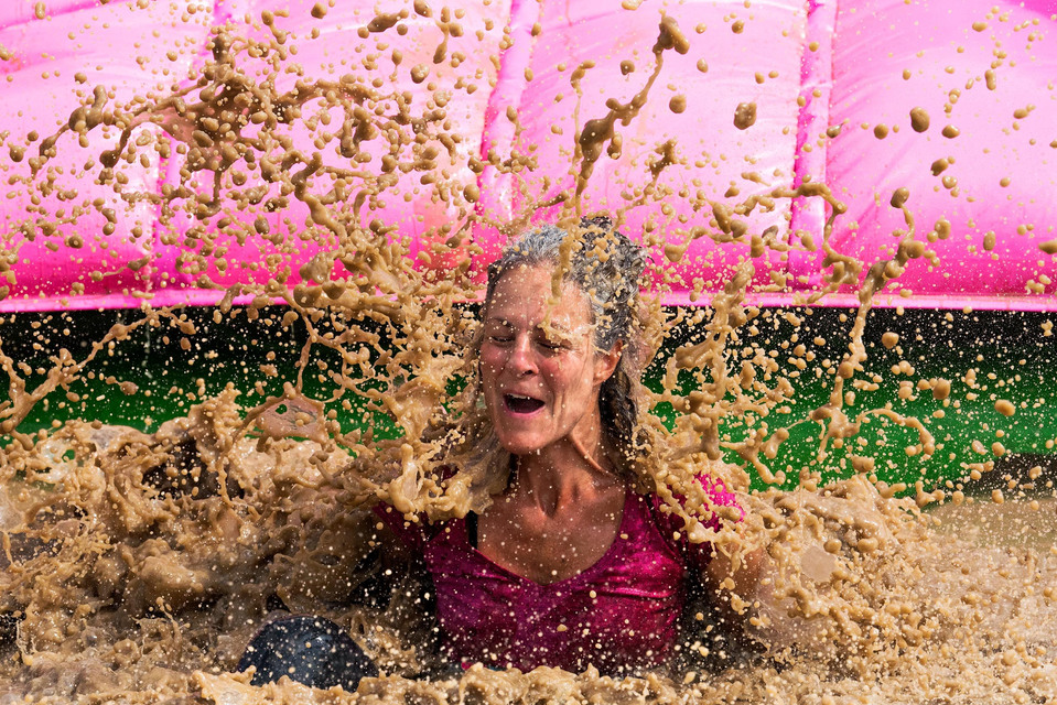 Mud splashes in the air during an obstacle course race.