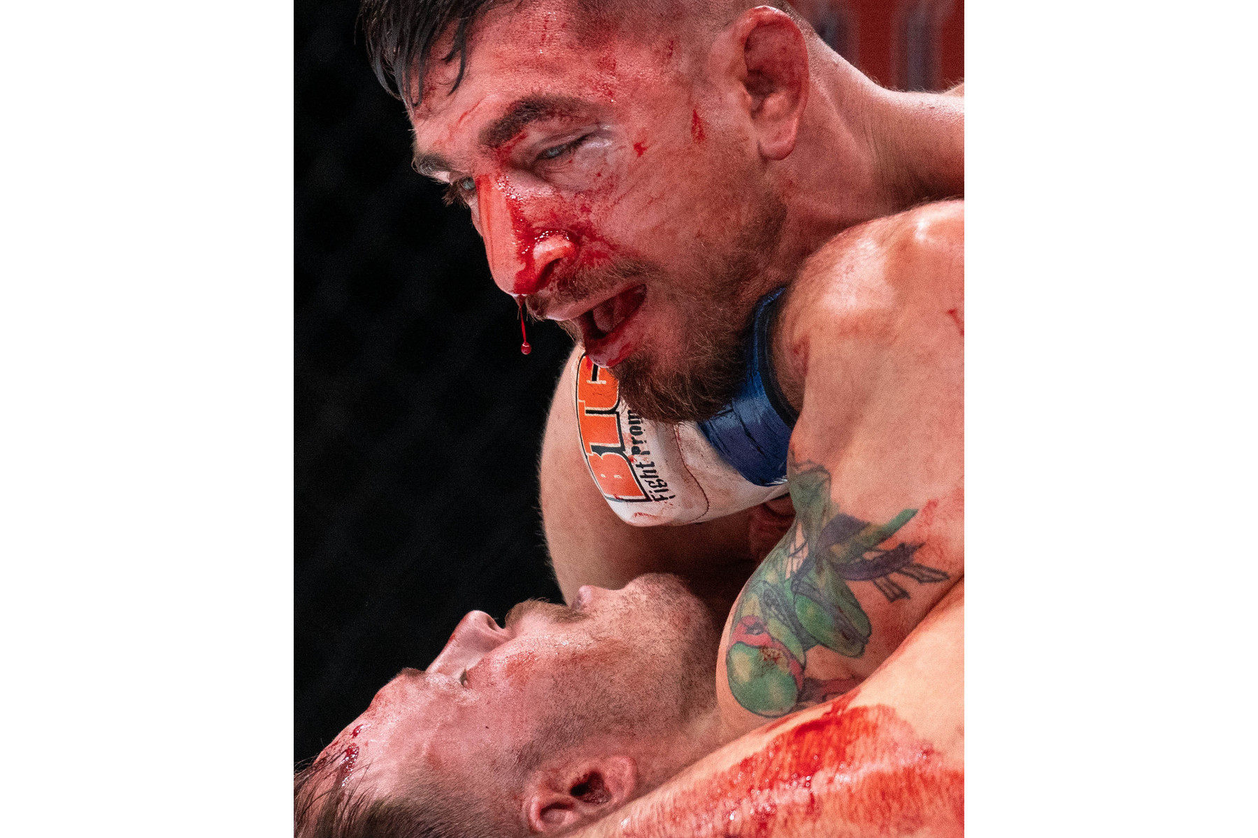 Blood drips from the nose of Gabe Sagman onto Matt Dawson during their bantamweight fight during the BTC 13 Power event at the Meridian Centre on Nov. 20, 2021 in St. Catharines, Ont. Sagman won the fight by unanimous decision. Photo by Alex Lupul