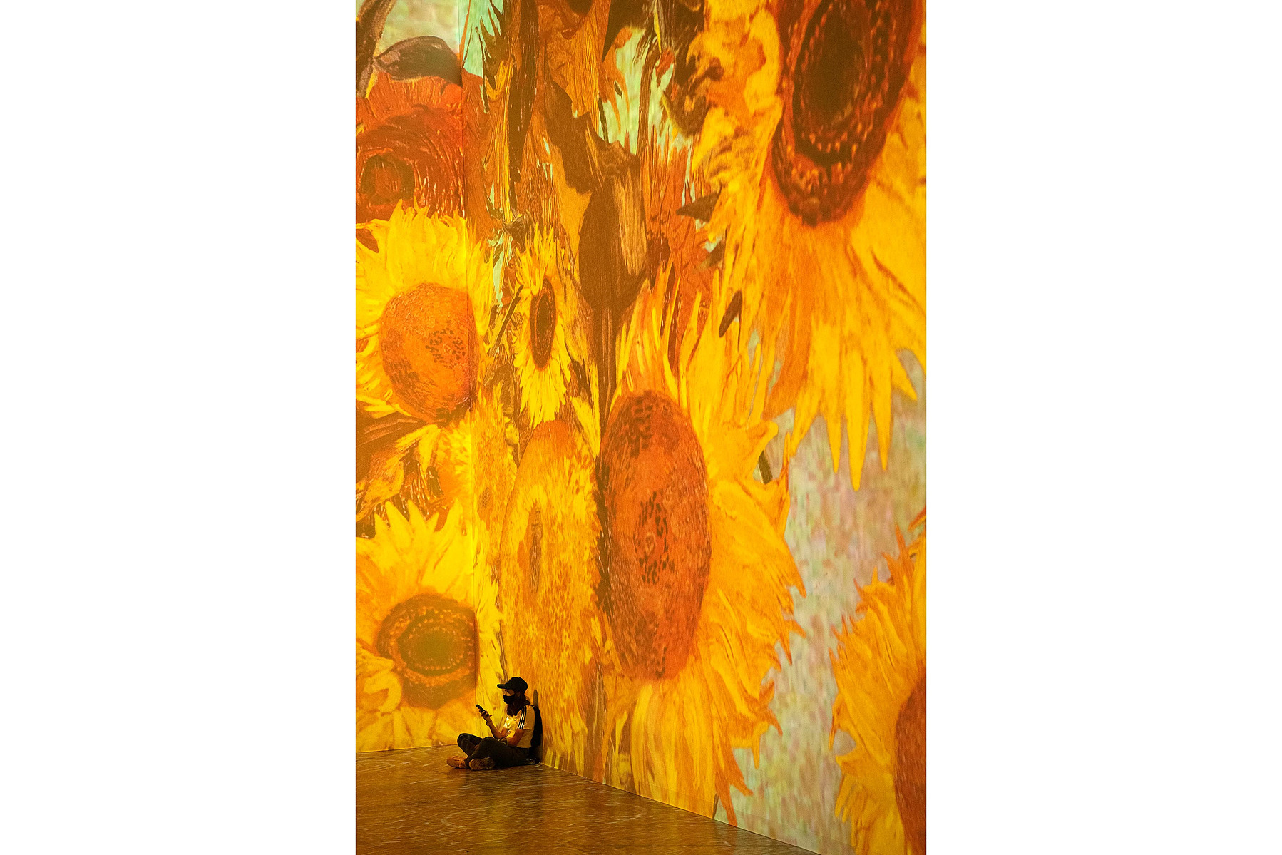 TORONTO, Ont. (11/09/21) - Visitors to Immersive Van Gogh--an audio-visual experience where artworks by Vincent Van Gogh are projected onto walls--are photographed in Toronto, Ont. on Sept. 11, 2021. Photo by Alex Lupul