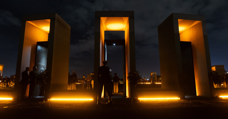 Three of the 12 portals stand illuminated during the Bonfire Remembrance Ceremony at the Bonfire Memorial on Monday, Nov. 18, 2024.