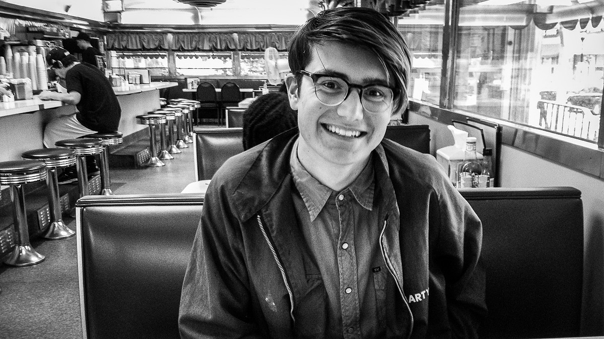 Young man sitting in booth at Bob's Diner in the Roxborough section of Philadelphia. 