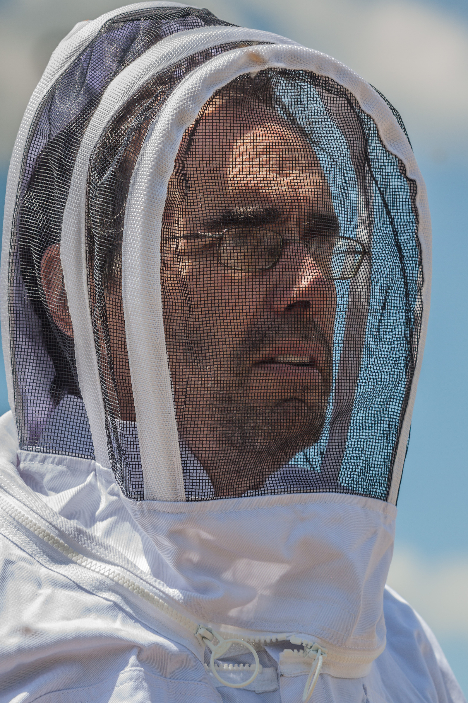 Beekeeper suited up to help with bee installation.