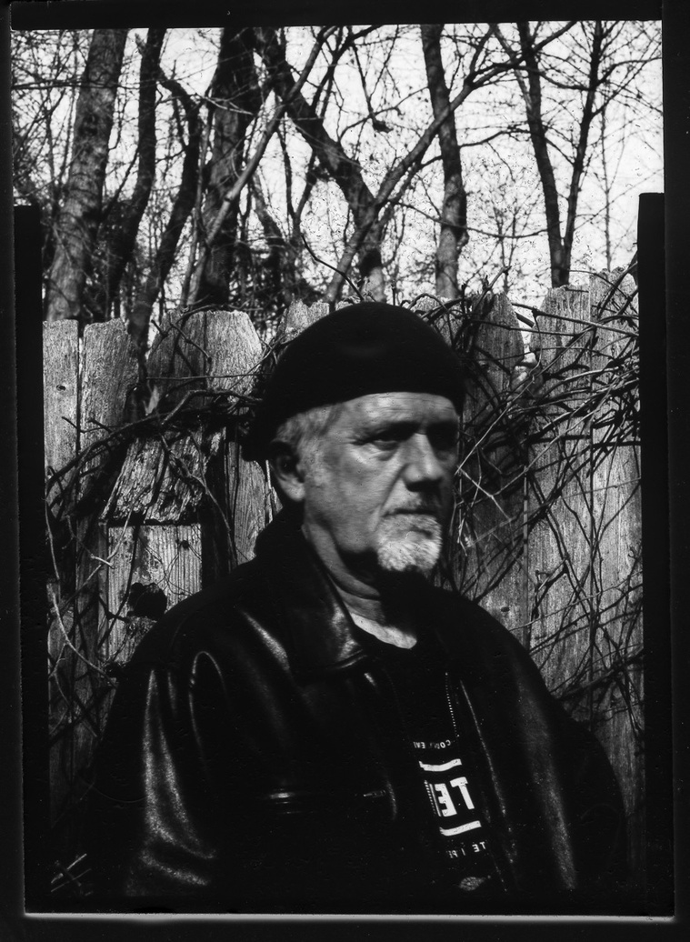 Black & white self portrait from paper negative shot using vintage Graflex camera. 