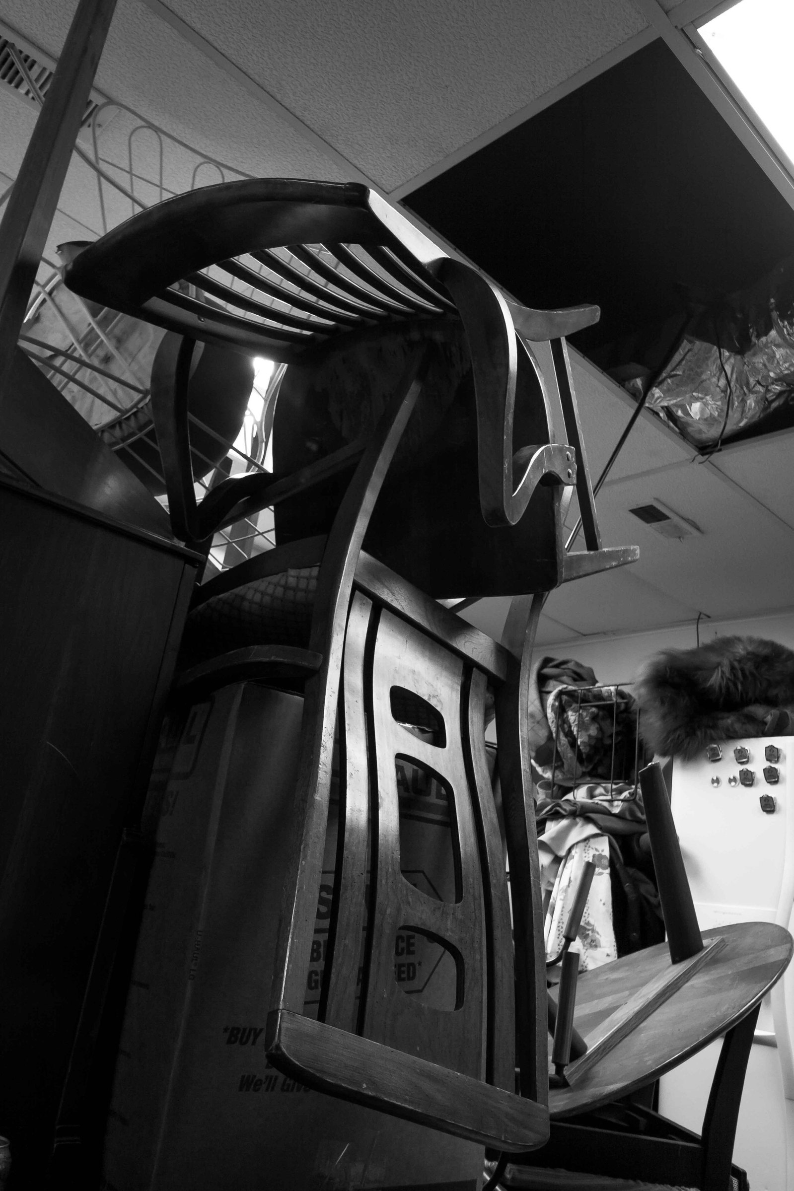 Chairs stacked in an absurd order