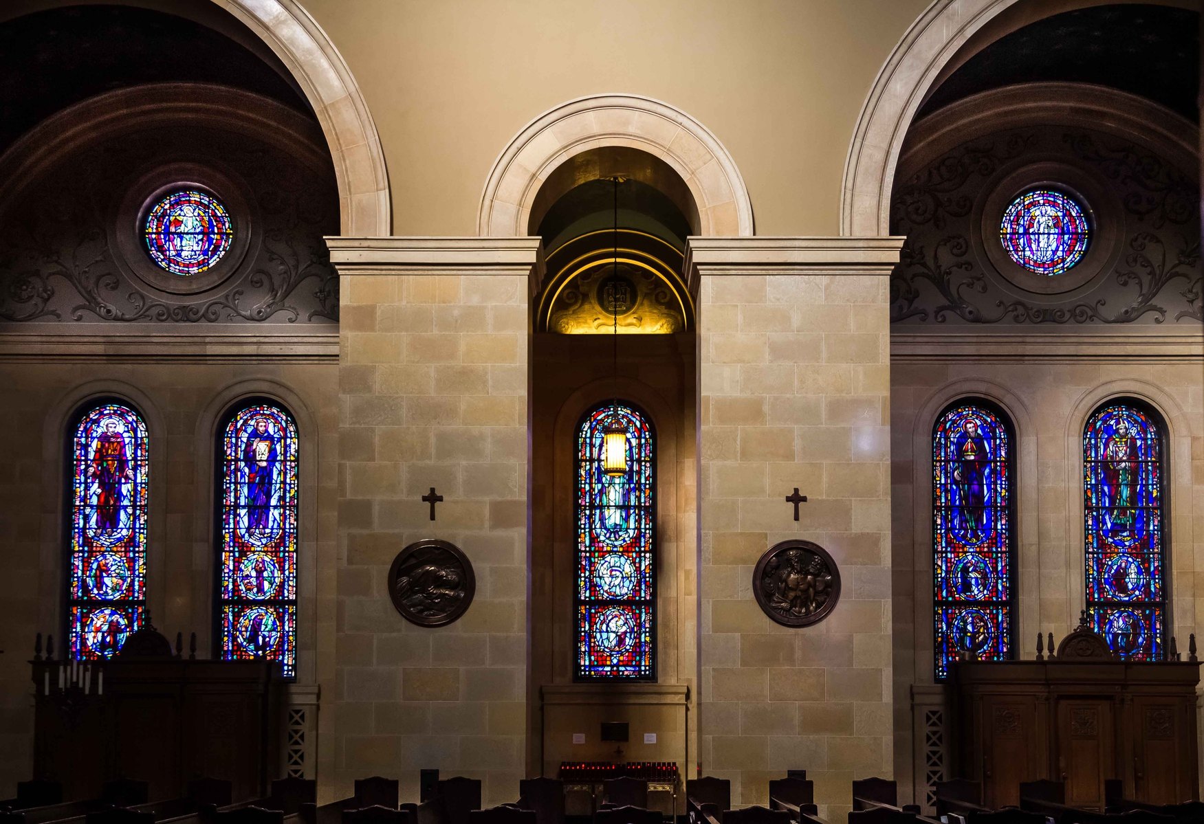 An image of stained glass windows in a church