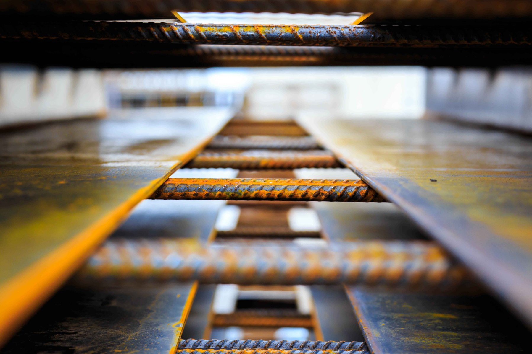 Looking in between Rebar at a construction site.
