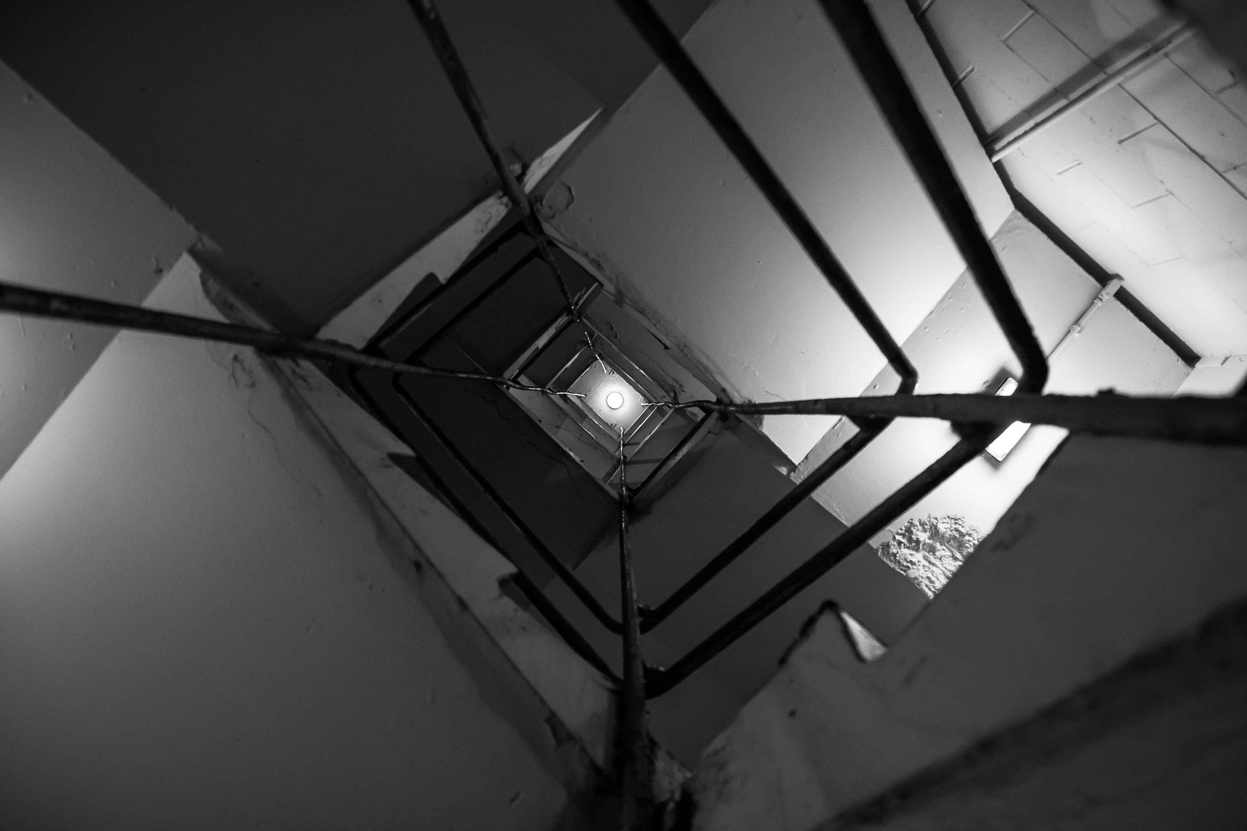Looking up at a parking garage stariway