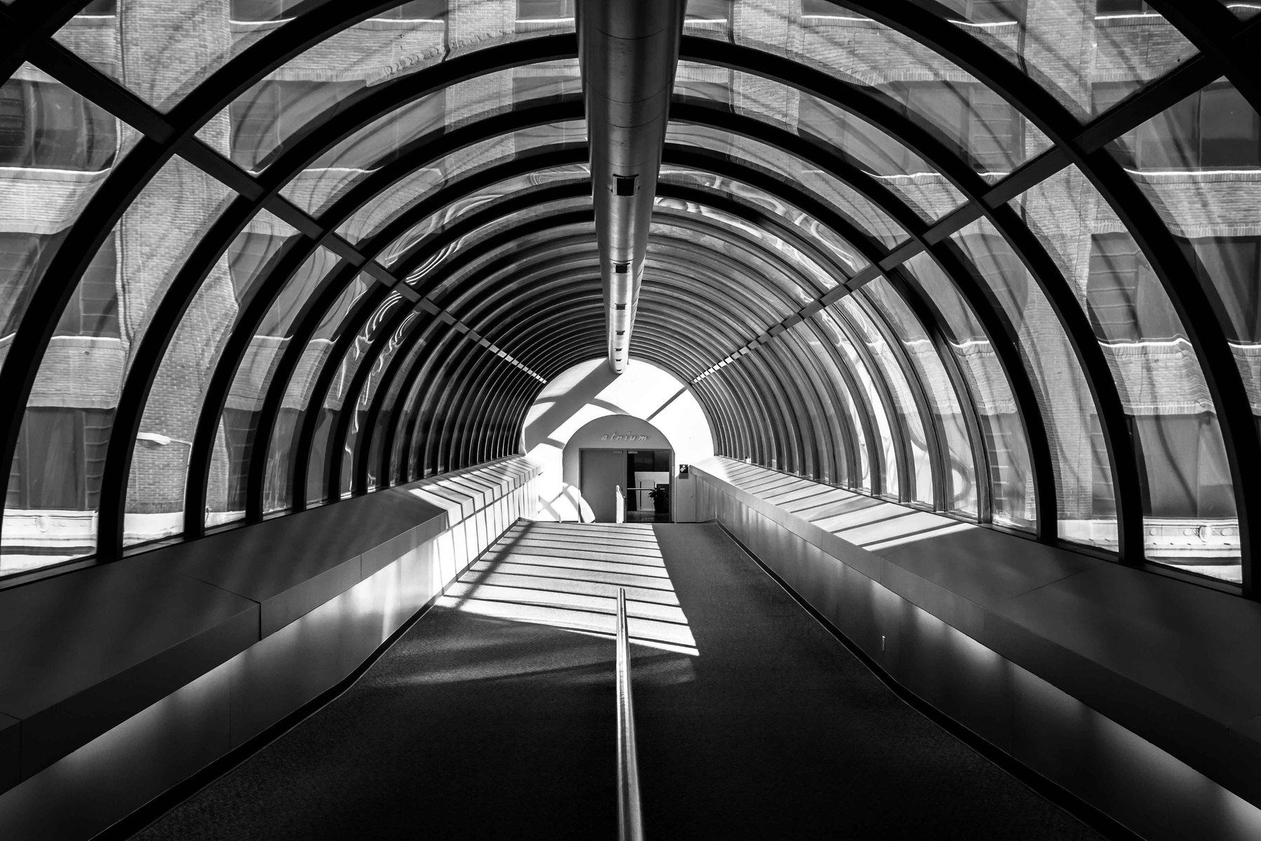 An image looking down a parking garage skywalk