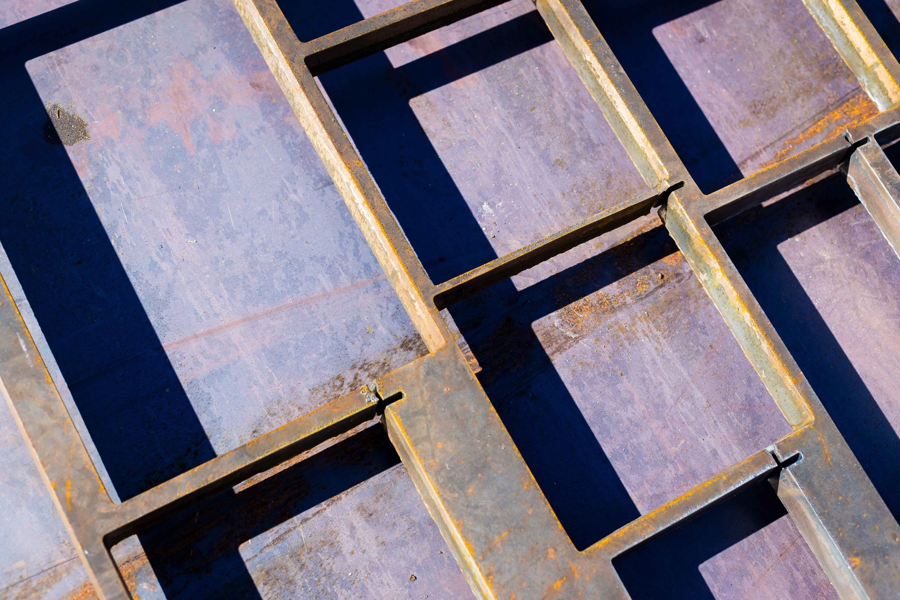 Looking at a sheet of scrap metal and the shadows it casts.