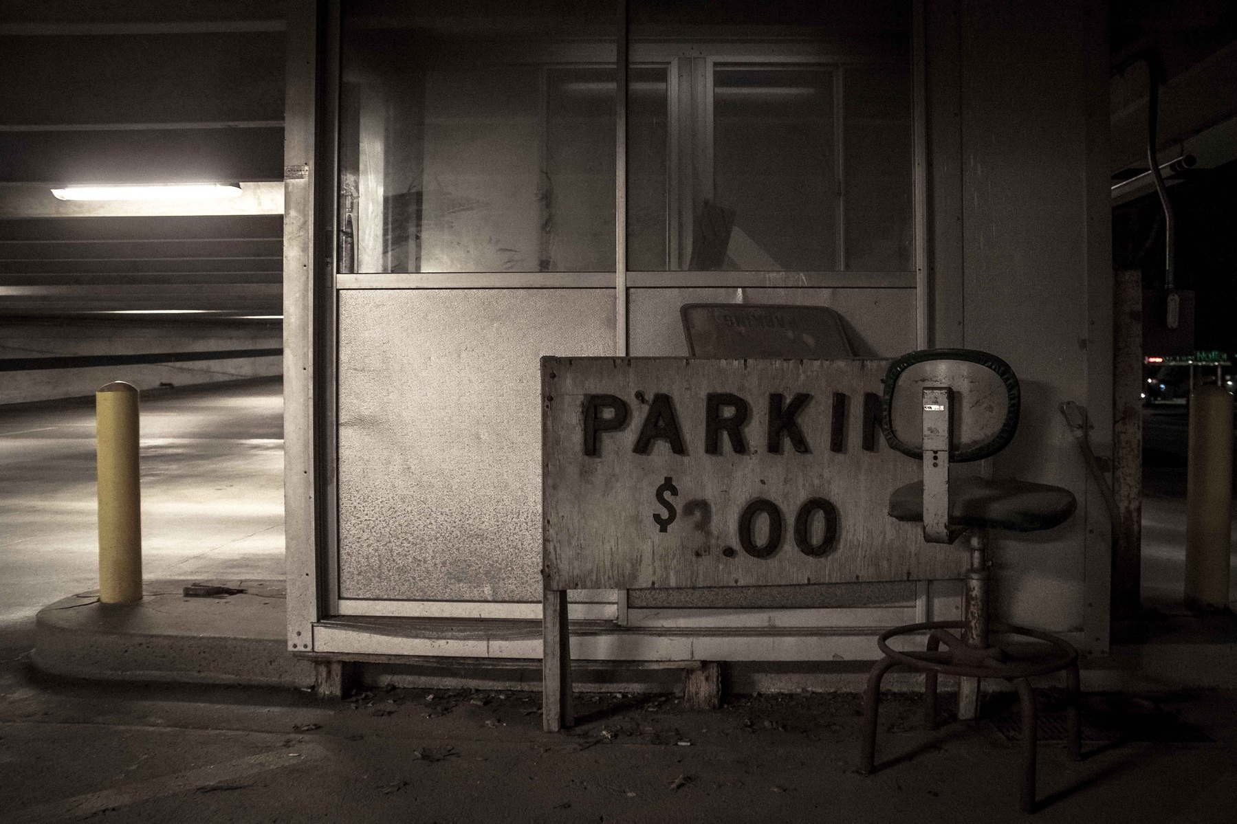 An old parking garage still displays it's pricing of $3 for a parking spot