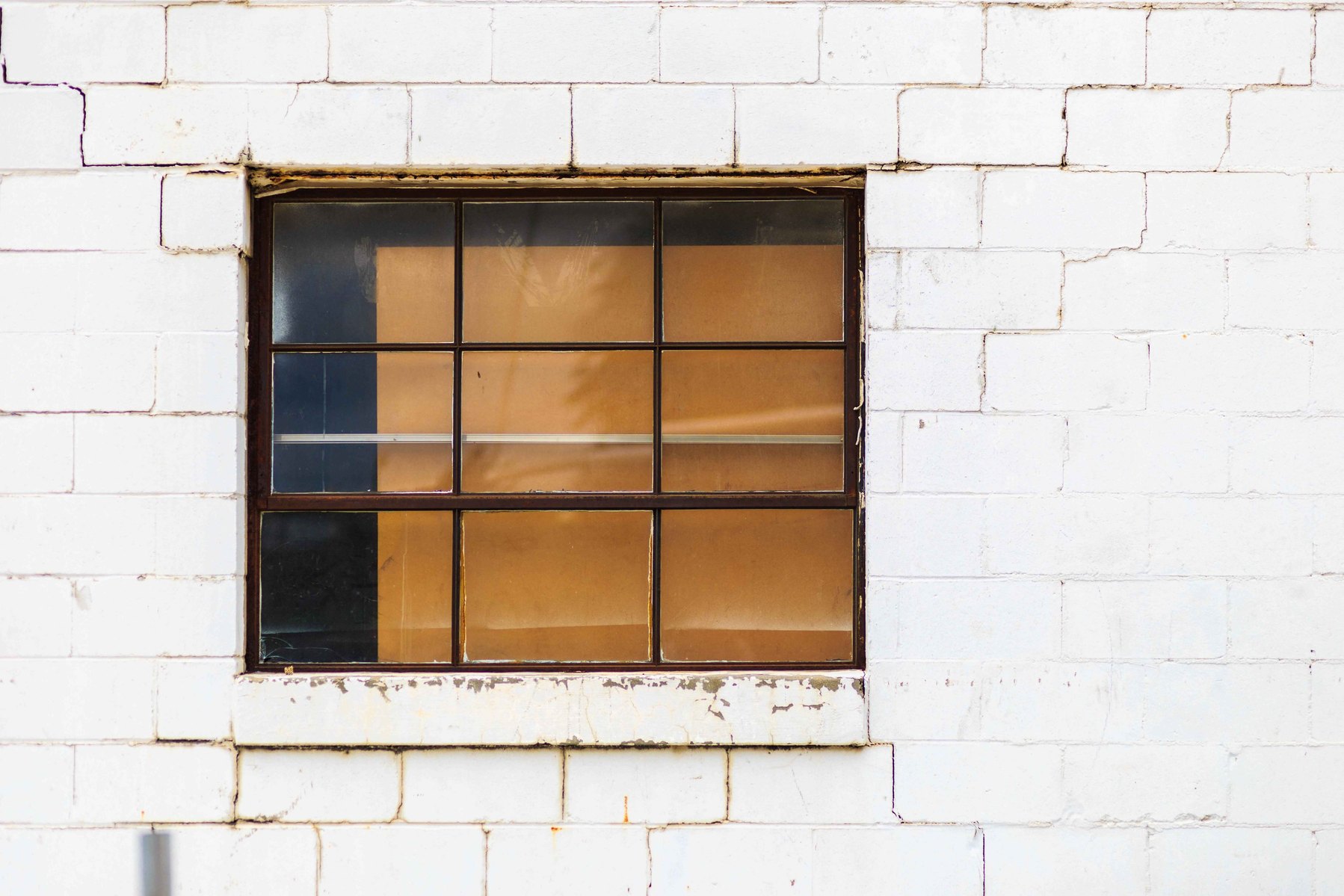 An abstract image of a window with gold backing.