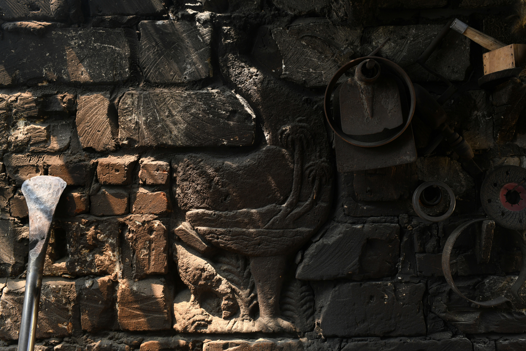 A headless statue of a rooster is lodged within an outer wall of Omar Khattab's house in the Siwa Oasis. The statue was one of Khattab's most treasured works before it was destroyed by fundamentalists in 2005.