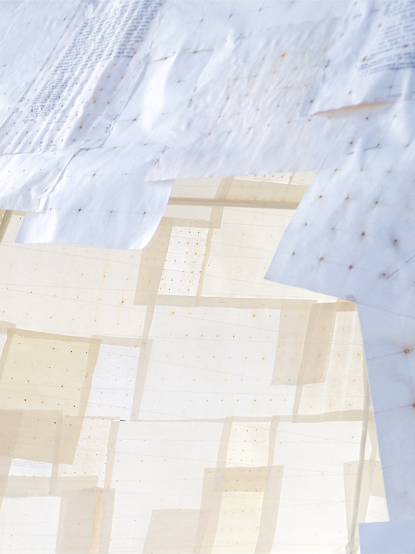 Shelter is an art installation made by gathering old drawing paper and mixing it with notes from Art History studies. Punctured with nails and left outside to rust, the paper was later used to create a shelter-like structure installed in a burned-out col