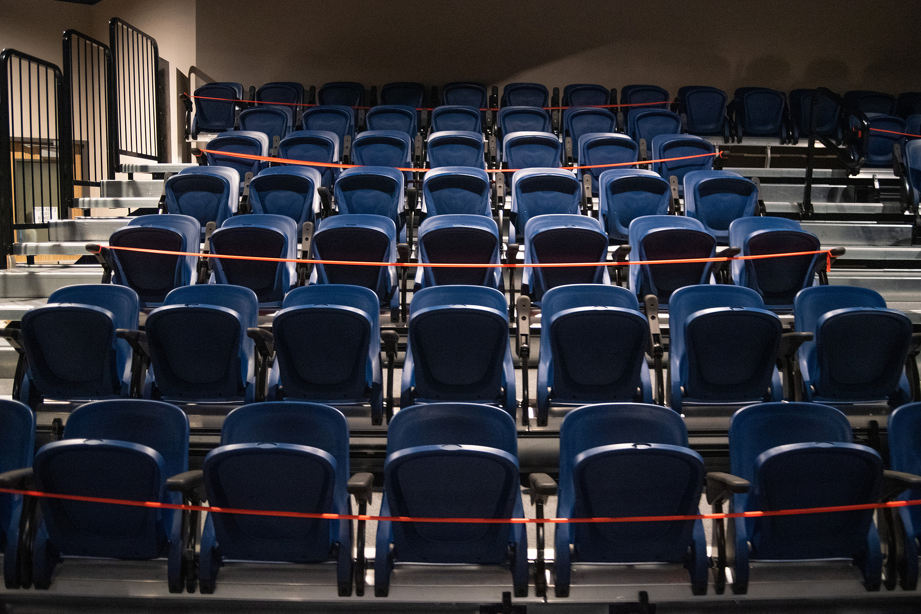 Orange tape is used to help spread out families from sitting close to one another in the balcony level of University Christian Church on Sunday.