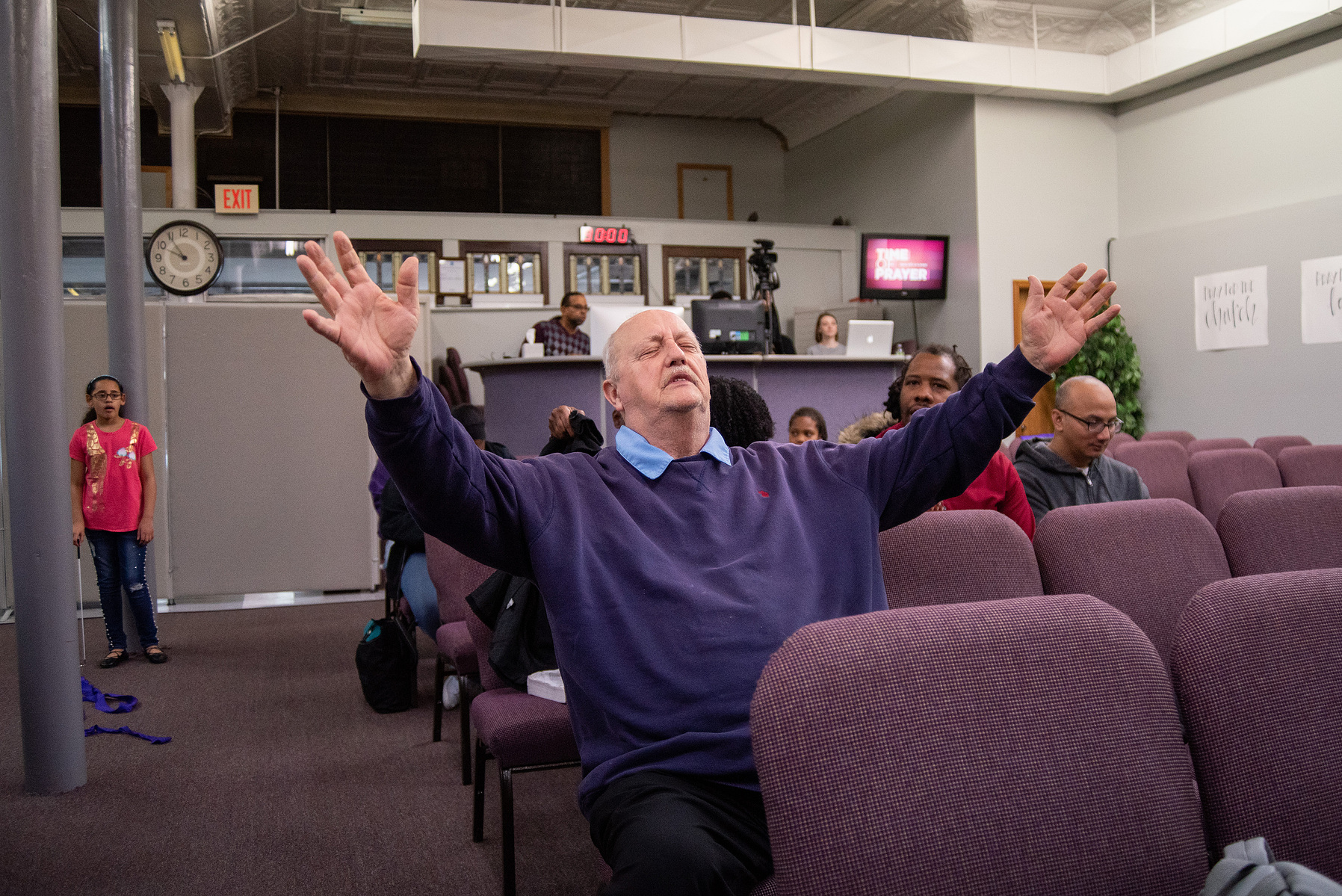 Ed Potter has a moment to himself during the Sunday morning service at the Manhattan Christian Fellowship Church.