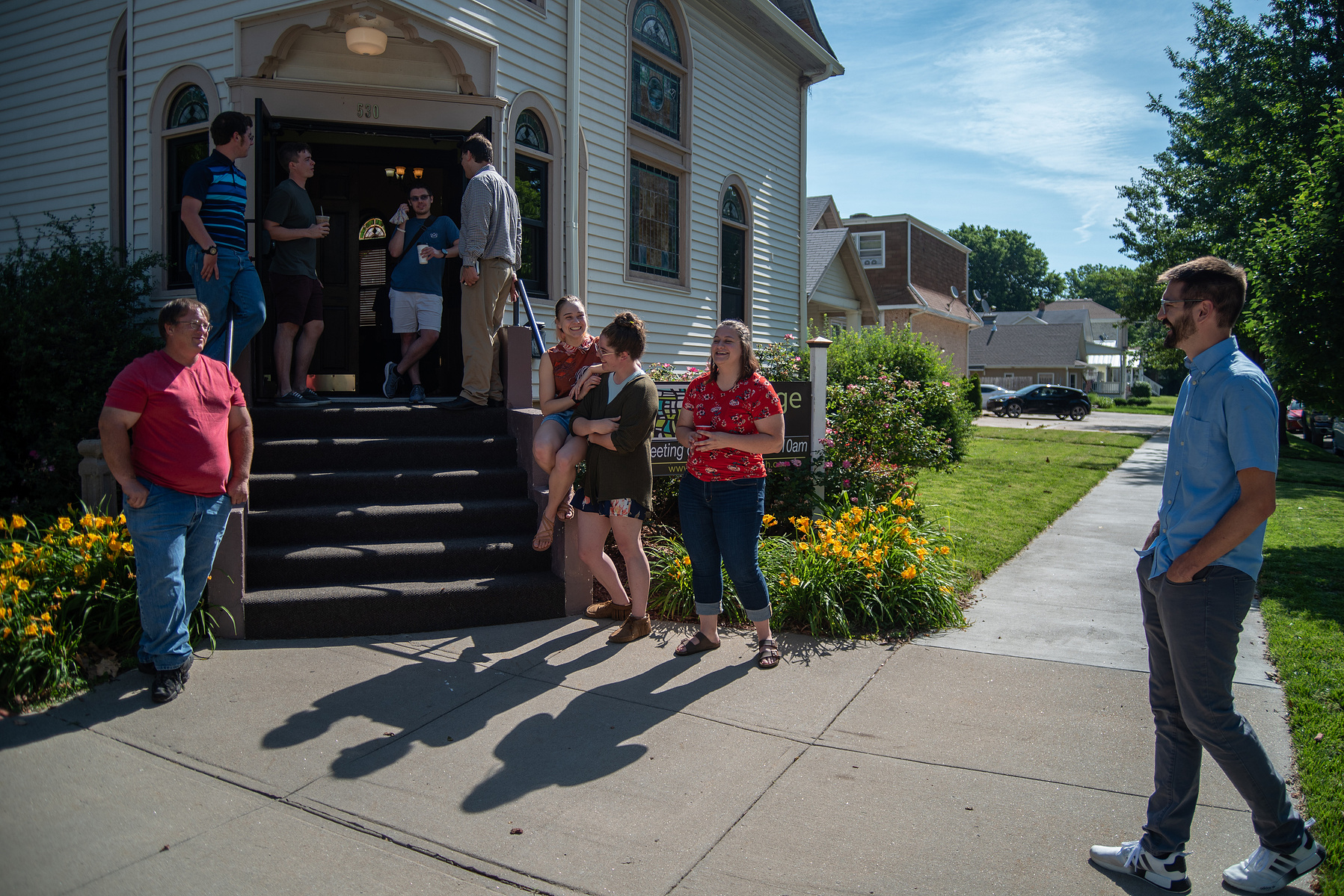 Pastor Jon Hastings, far right, stands outside of Vintage Faith Church before Sunday’s service.