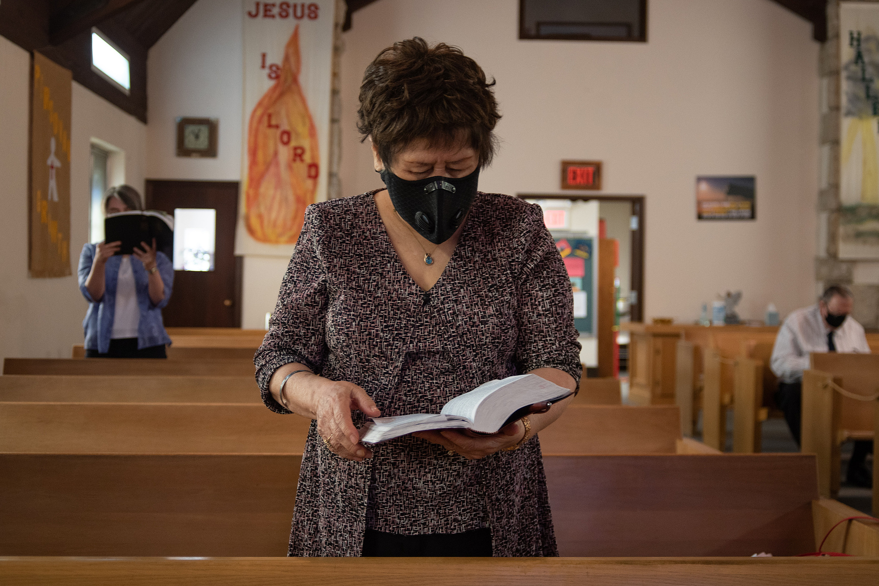 Myoung Marrow reads the Bible during service at Manhattan Free Methodist Church on Sunday.