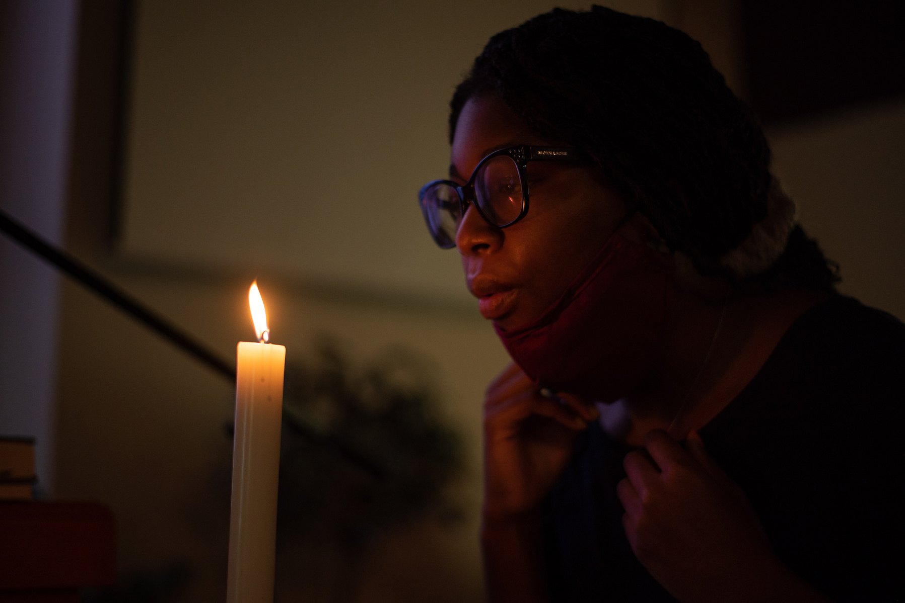 Ashantae Smith blows out the candles in front of the altar following Sunday morning’s service at Manhattan Free Methodist Church.