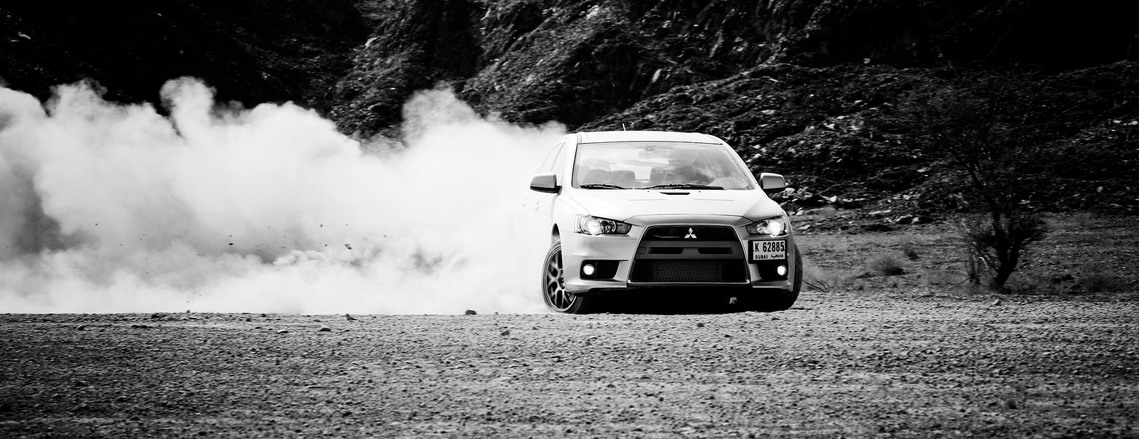 Mitsubishi Evo drifting on gravel for an editorial photoshoot for Car Magazine Dubai